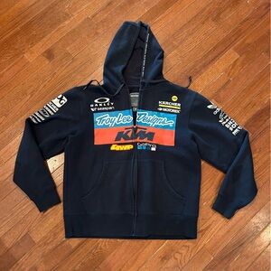 Troy Lee Designs KTM Team zip-up hoodie featuring various sponsor logos.